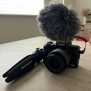 Canon EOS M50 Mark II with 15-45mm lens + rode microphone + manfrotto tripod